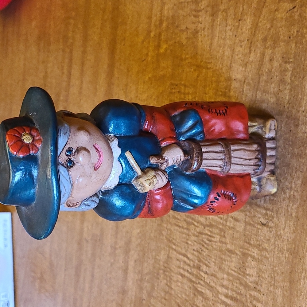 Ceramic lady churning butter